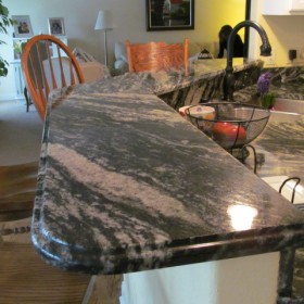 color midnight granite counter and raised bar